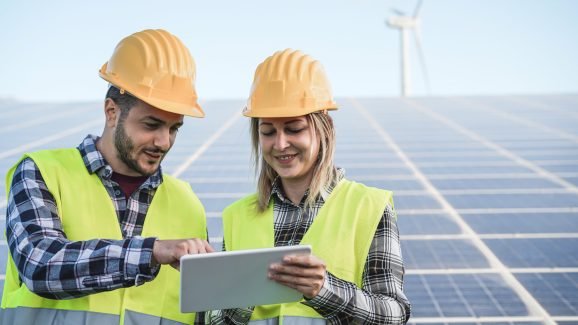 young-people-working-with-digital-tablet-at-renewa-2025-10-14-07-35-07-utc